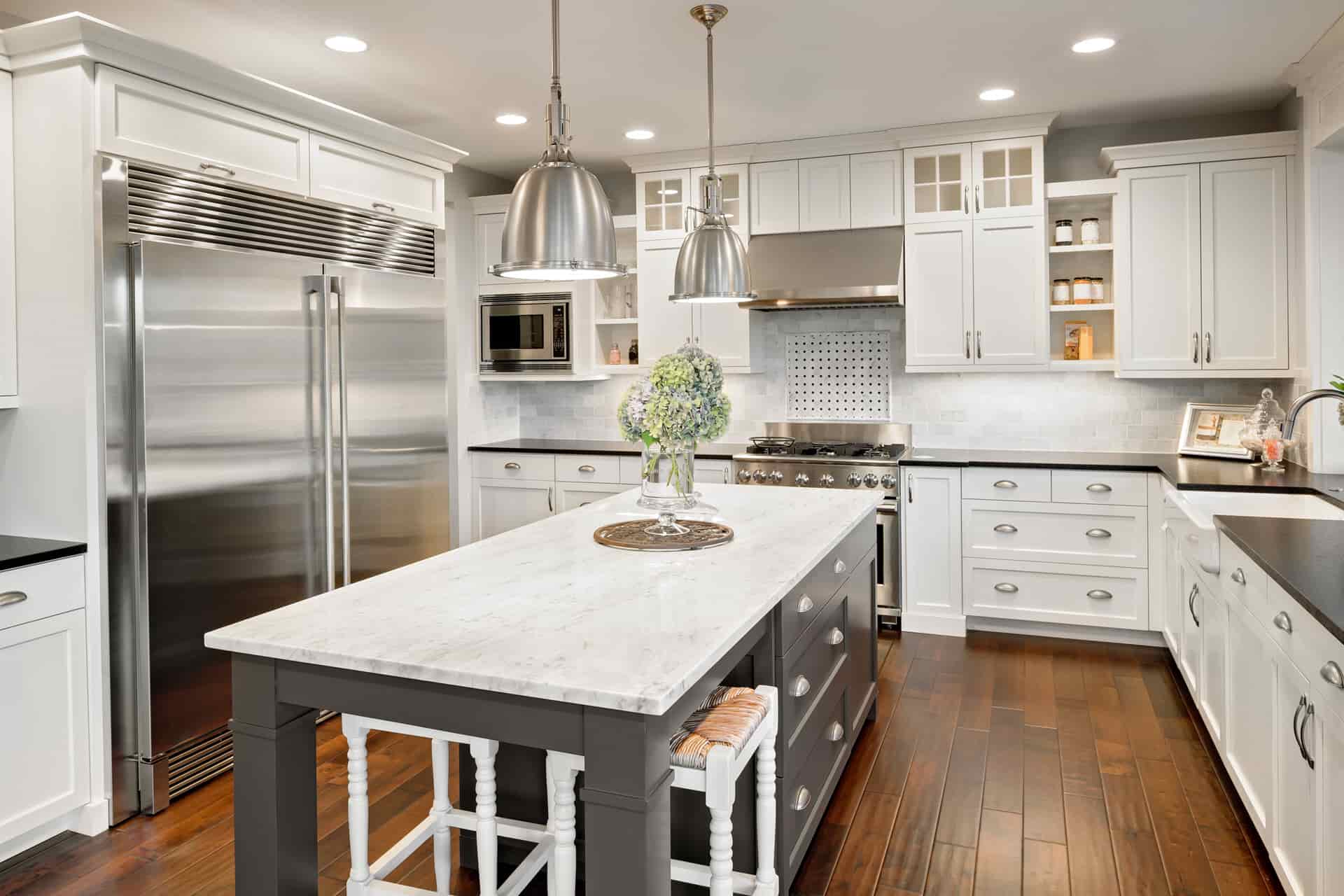 sleek white kitchen with custom cabinetry