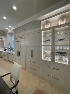 Semi Custom Large Kitchen With Dining Custom Display, Integrated Subzero Appliances, Custom Wood Pantry, Shaker White Cabinetry With Led Lighting, Glass Shelves.